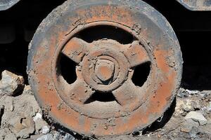Close-up of a muddy industrial wheel. photo