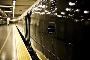 Close-up of a sleek train at a modern station platform. photo