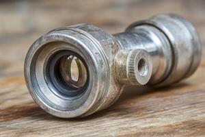 Close-up of a vintage metal telescope lens. photo