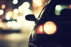 Nighttime car rear view with blurred lights. photo