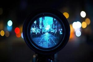 Nighttime cityscape reflected in a lens. photo