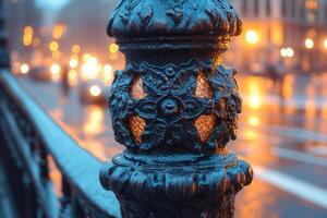 Ornate lamp post detail illuminated in urban setting. photo