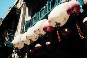 Decorative lanterns hanging in a vibrant street scene. photo