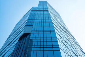 Modern skyscraper with reflective glass facade. photo