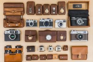 Collection of vintage cameras and accessories displayed neatly. photo