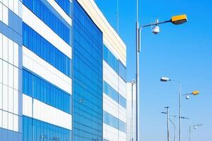 Modern building with reflective glass and streetlights. photo