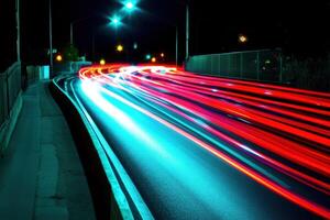 Nighttime long exposure of car lights on a road. photo