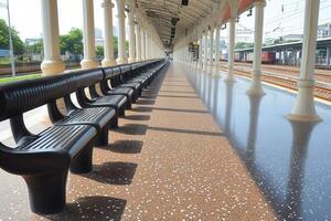 Empty train station platform with benches and polished floor. photo