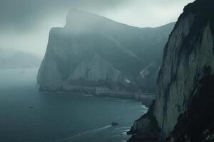 Misty coastal cliffs with a serene ocean view. photo