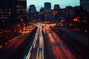 Nighttime cityscape with light trails on a highway. photo