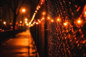 Night scene with illuminated fence and pathway. photo
