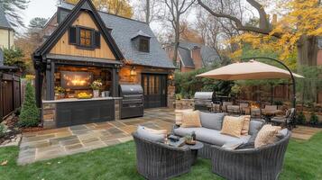 A backyard with a grill, patio furniture and a fireplace photo
