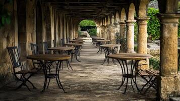 Empty tables, arched garden cafe, serene background, summer photo