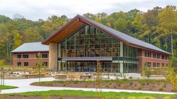 Modern building, autumn woods, open space, campus photo