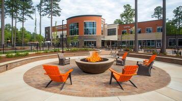 Outdoor fire pit, plaza seating, modern building, sunny day photo