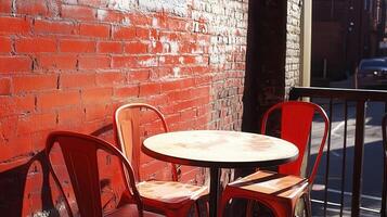 Red chairs, table, brick wall cafe patio photo
