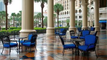 Resort patio, rain, city view, empty chairs photo