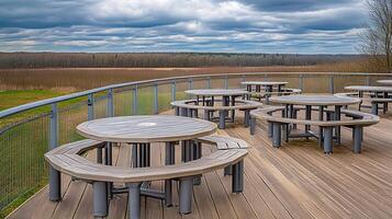 Scenic park picnic tables overlook field photo