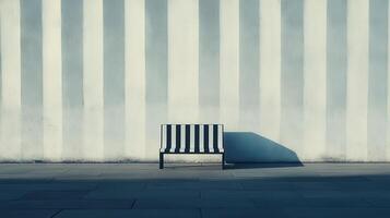 Striped bench, urban wall, sunlight, shadow, waiting photo