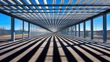 Sunlit metal walkway, shadows, industrial park photo