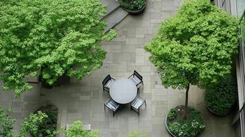 Urban courtyard garden, table, chairs, trees, aerial view photo