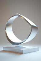 Abstract metal sculpture on a pedestal photo