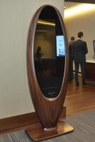 Modern, oval-shaped, interactive mirror photo
