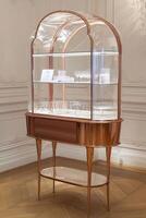 A glass display case with a glass top and a glass shelf photo