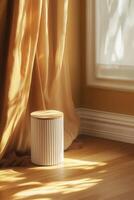 Warm, sunlit corner with a decorative stool photo