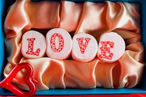 candies on golden background for valentine's day photo