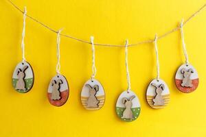 Easter decorative eggs with bunnies hanging photo