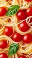 A Delightful Italian Spaghetti Dish with Fresh Basil and Tomatoes photo