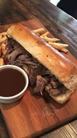 Savory Roast Beef Sandwich with Crispy Fries photo