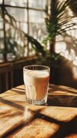 Warm Drink in a Glass Under Sunlight photo