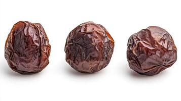 Three Exquisite Dried Dates on a White Background photo