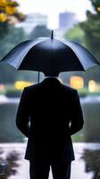 Rainy Day Reflection A Businessman's Contemplation photo