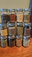 Assorted Grains and Spices in Glass Jars photo