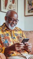 Smiling Senior Man Using Smartphone photo
