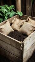 Rustic Wooden Box Filled with Soil and Burlap Bags for Gardening photo