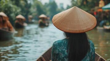 Asian Woman in a Traditional Boat on a Canal photo