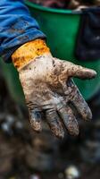 A Hand in Action Dirty Work Gloves photo