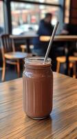 Chocolate Smoothie in a Glass Jar - Refreshing Drink at a Cafe photo
