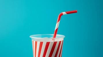 Striped Plastic Cup with Red Straw - Refreshing Drinkware photo
