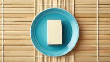 Single Tofu Block on a Blue Plate, Simple Healthy Food photo