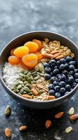 Nutritious and Colorful Breakfast Bowl with Dried Apricots, Blueberries, and Nuts photo