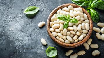 Nutritious White Beans in Wooden Bowl with Fresh Basil photo