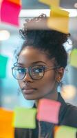 Focused Woman in Meeting with Post-it Notes photo
