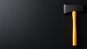 Black and Yellow Axe on Gray photo