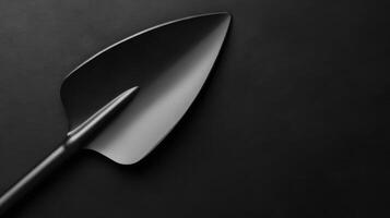 Glossy Black Spade Close up on Black photo