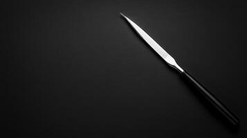 Simple Letter Opener on Dark Background Still photo